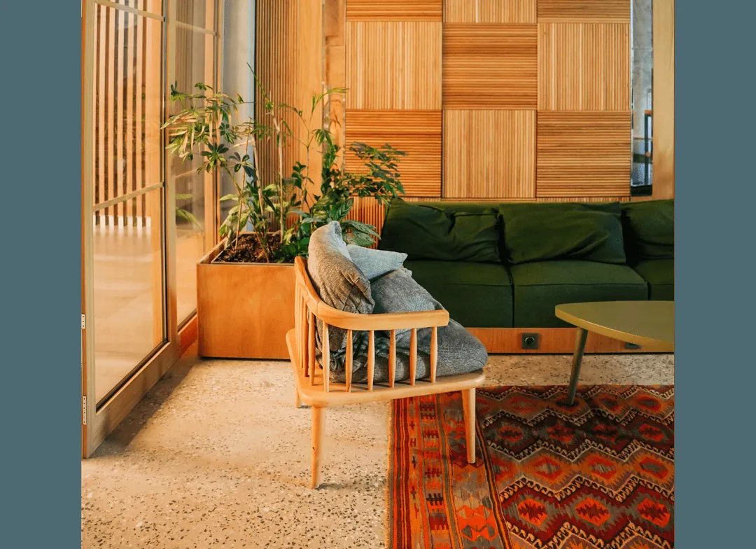 A warm, plant-filled lounge space