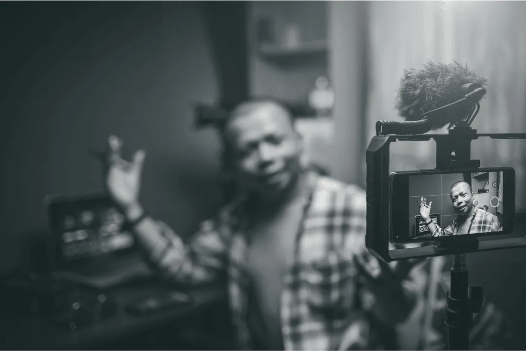 A creator filming himself on a phone rig