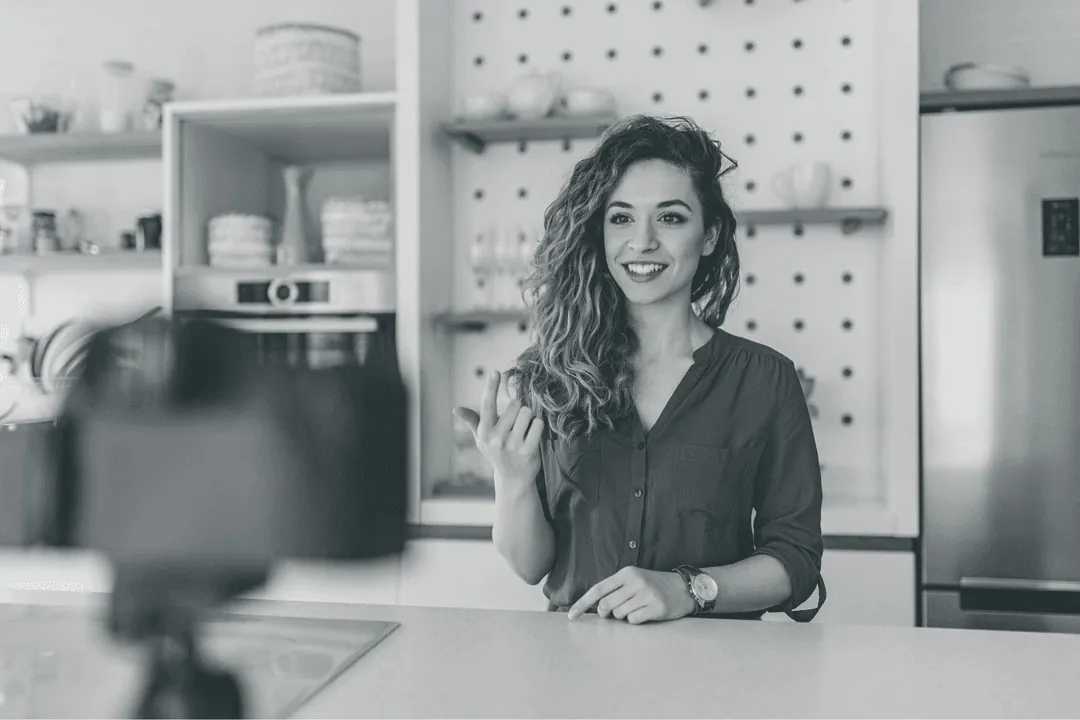A creator recording a video at her desk