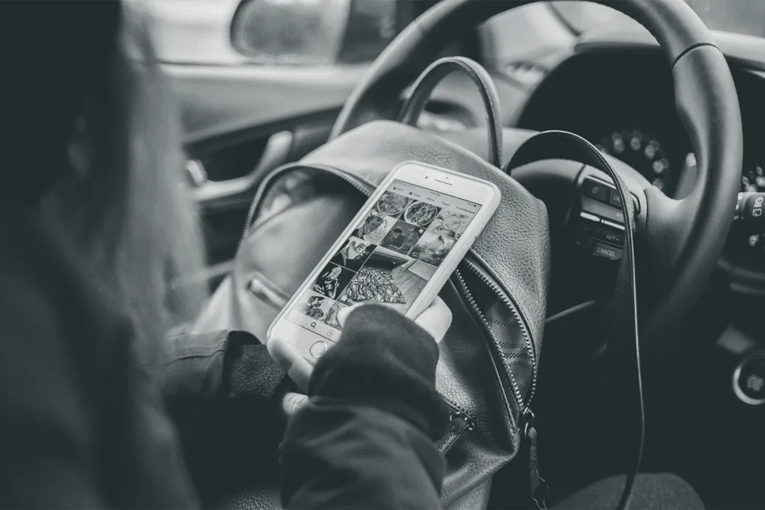 Someone checking a social app on their phone